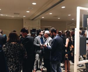 Guests arrived early and filled the photo exhibit space before the dinner